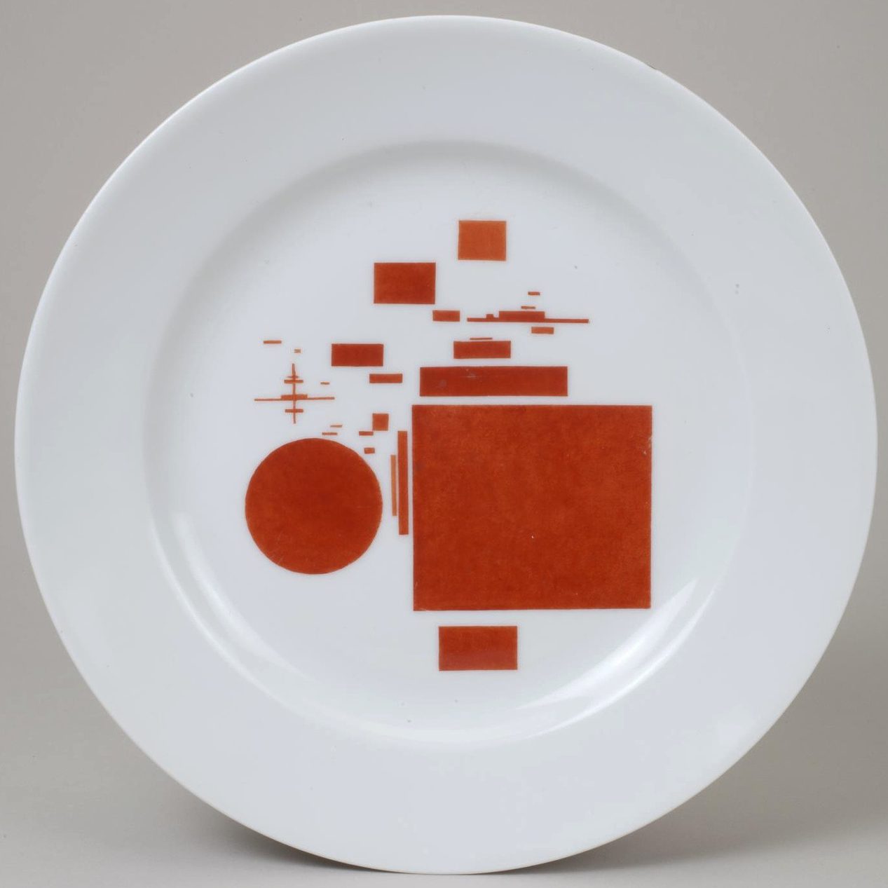 Soviet porcelain plate "Red Rectangles and Circle". Suprematism. Nikolai Suetin. Lomonosov State Porcelain factory, St Petersburg, USSR