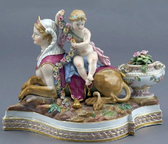 Meissen Figural Group of putto sitting on sphynx. Model 17
