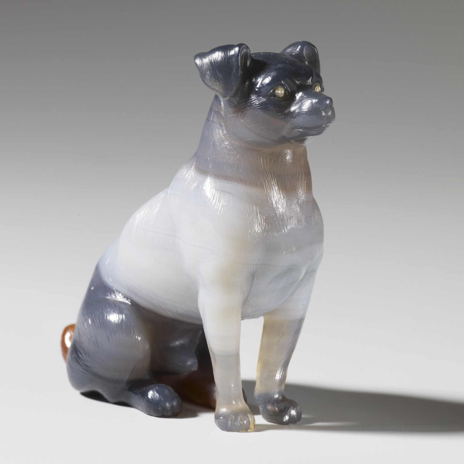 A variegated grey and brown agate seated retriever with rose diamond eyes. Faberge dog figurine.