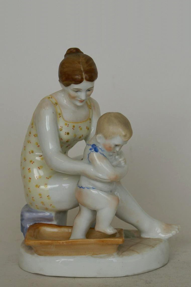 Soviet porcelain figural group of mother giving a bath to a child. Modeled by Kazimir Rishov. Lomonosov State Porcelain Factory, St Petersburg, USSR