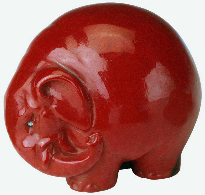 Purpurine elephant in netsuke shape