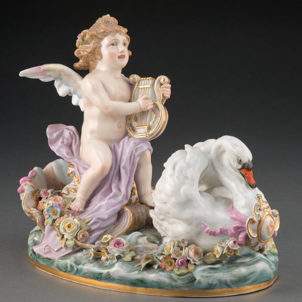 Meissen figural group depicting cupid riding a floral chariot with the swan