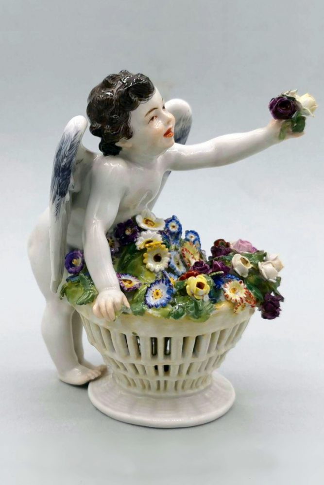 Meissen cupid with a basket of flowers. Model Y123