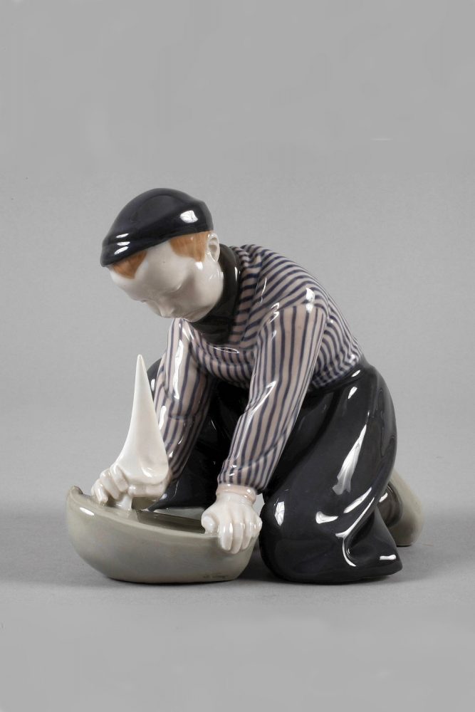 Meissen figure of Dutch Boy with toy ship by Philipp Lange. Model number A270