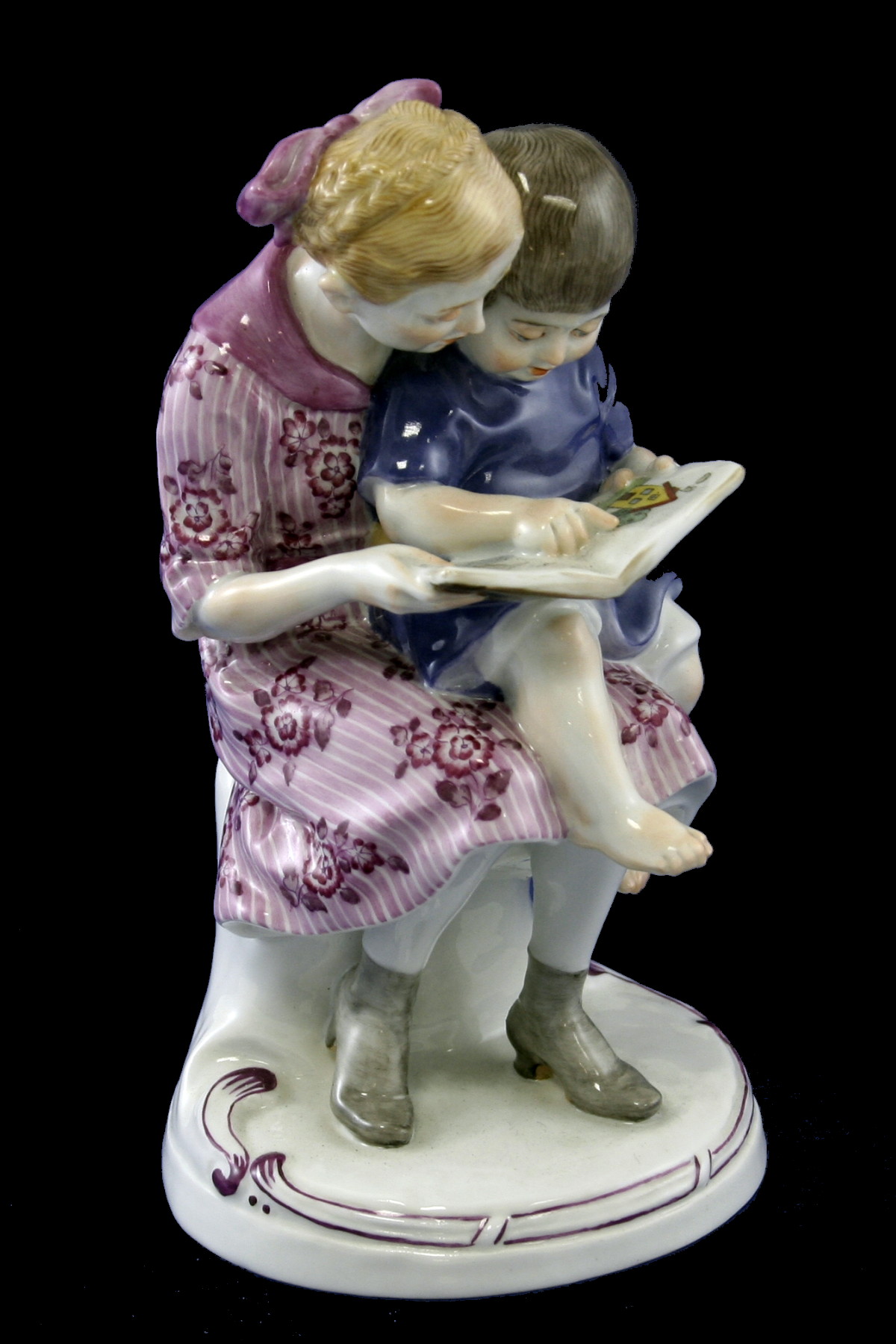 Meissen figural group of Two Children with the picture book. Model number F268 by Alfred Konig