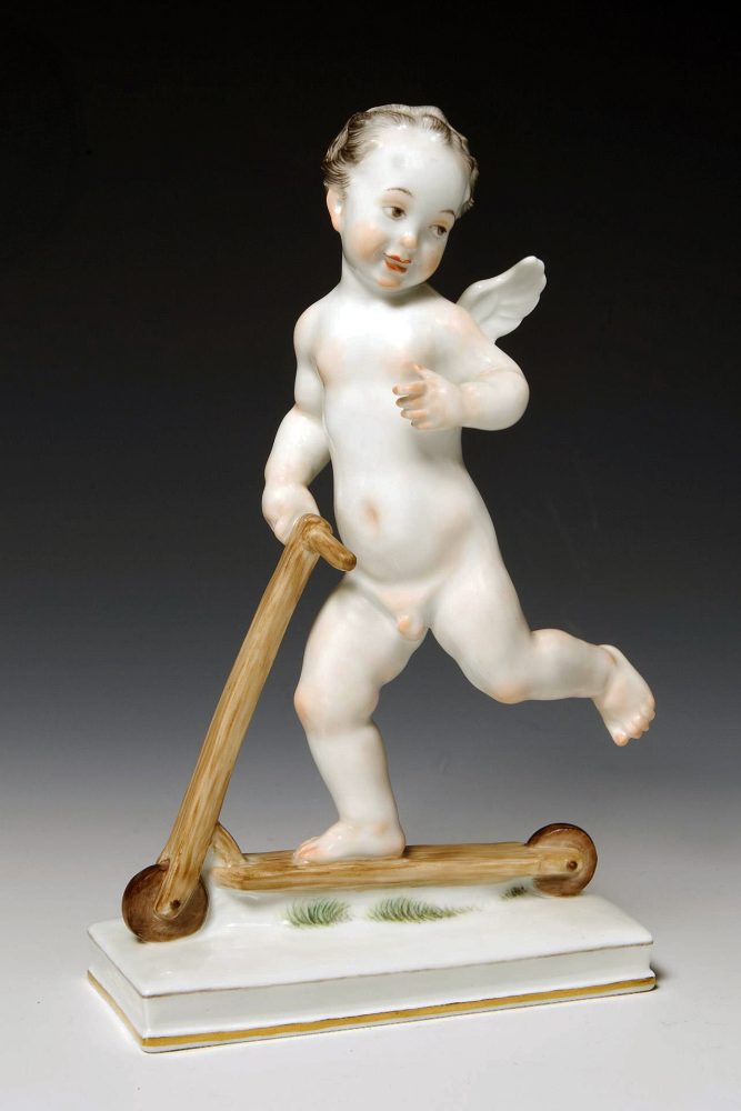 Meissen porcelain figure of Cupid on Scooter