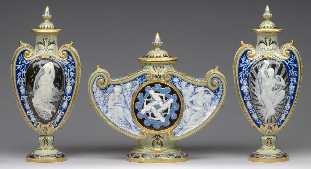 Minton Pate-Sur-Pate clock garniture by Louis Solon 1684 including a pair of vases with covers.