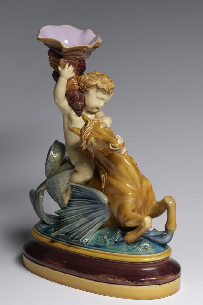 Minton 326 Majolica figure of Triton on Seahorse holding a shell