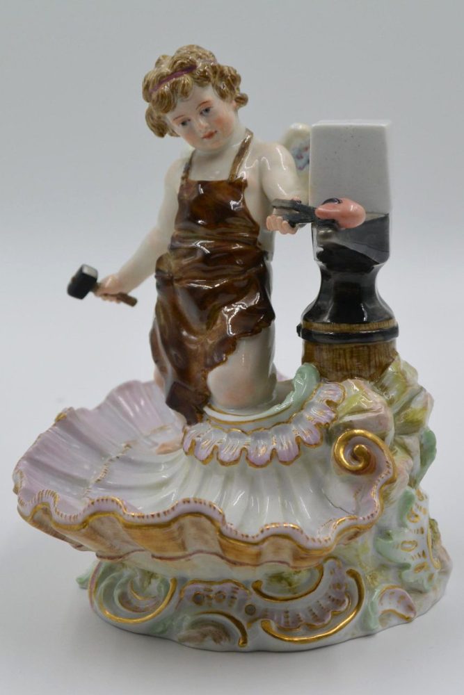 Meissen cupid blacksmith. Model number O 143