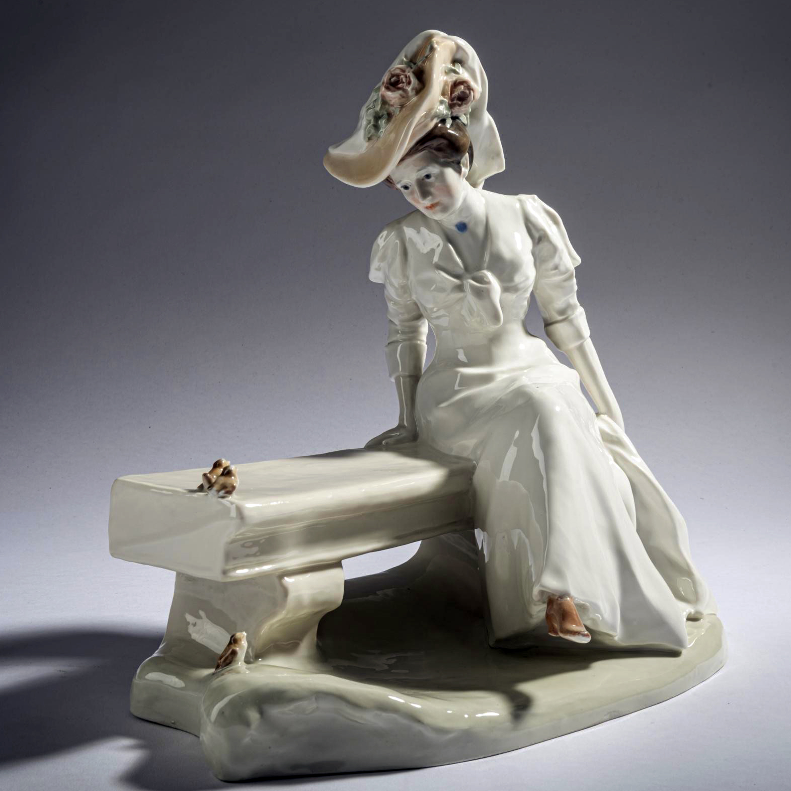 Meissen lady on a bench by Hentschel. Model number X166